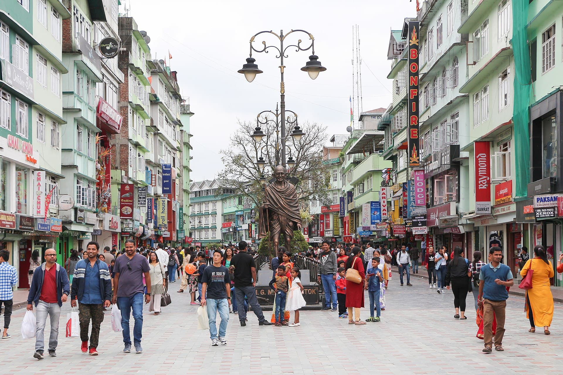 Gangtok's pedestrian MG Marg full of evening strollers, ornate lamp posts and the Mahatma Gandhi statue mid-promenade